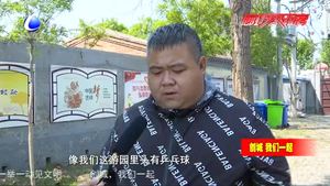 “紅馬甲”扮靚創(chuàng)城路上風景線